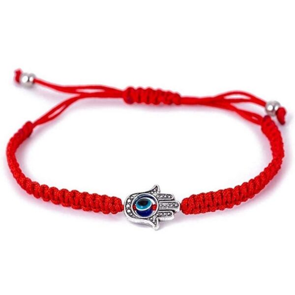 A vibrant red braided cord bracelet featuring an adjustable sliding knot closure and a silver-toned Hamsa hand charm with a central blue Evil Eye.