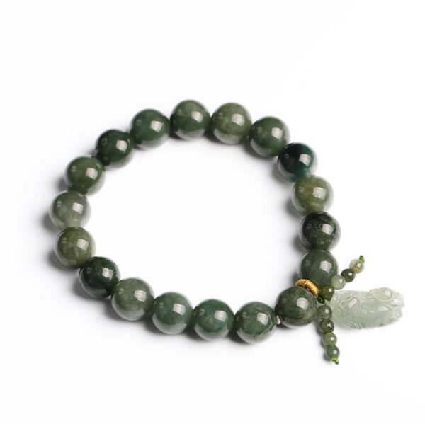 Polished dark green jade beads strung together with a carved light green Pixiu charm and gold accent thread.