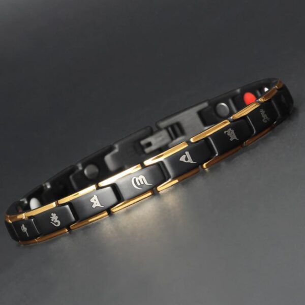 A robust black titanium link bracelet featuring gold inlays, red germanium dots, and sacred Tibetan mantra engravings.