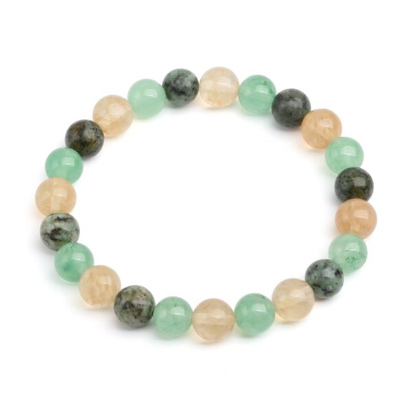 This beaded bracelet showcases an alternating pattern of polished golden citrine, light green aventurine, and speckled dark green turquoise stones.