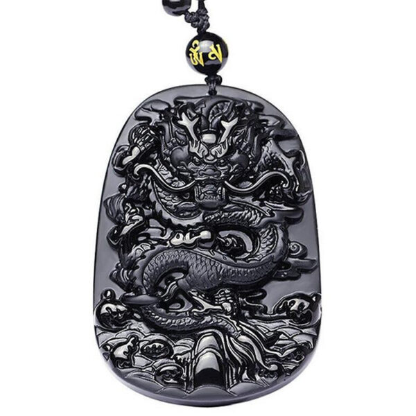 A glossy black obsidian pendant featuring an intricately carved Chinese dragon relief suspended on a matching bead necklace.