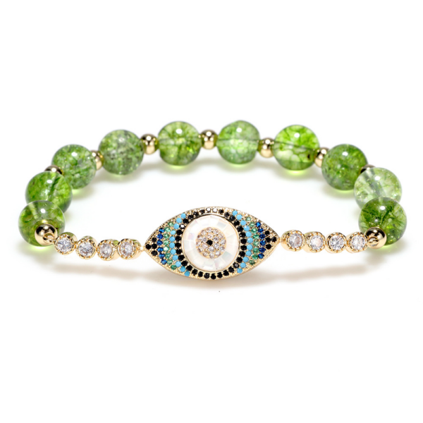 Vibrant green peridot beads surround a central protective evil eye charm on an adjustable cord.