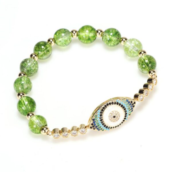 Vibrant green peridot beads surround a central protective evil eye charm on an adjustable cord.